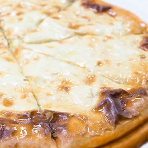 Фото товара 'Осетинский пирог с картофелем, сыром и беконом'